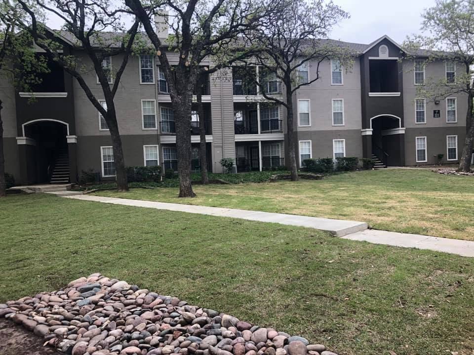 Commercial property concrete sidewalk and landscape maintenance at an apartment complex in the Dallas-Fort Worth Metroplex by Horseshoe Landscaping and Construction